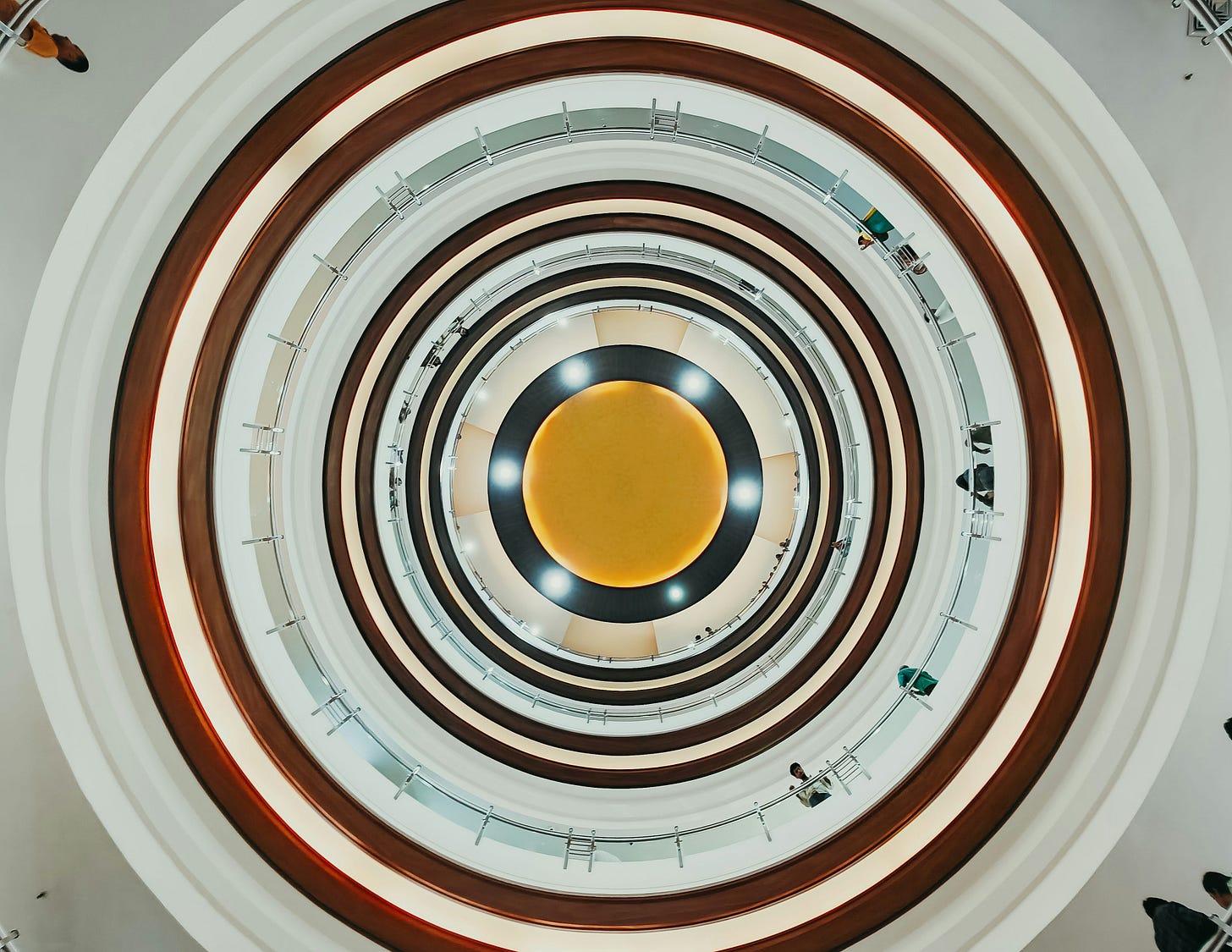 an overhead view of a circular ceiling in a building an overhead view of a circular ceiling in a building