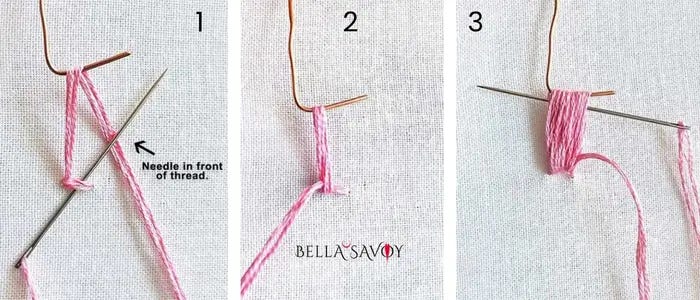 hook holding up thread from fabric to create loops