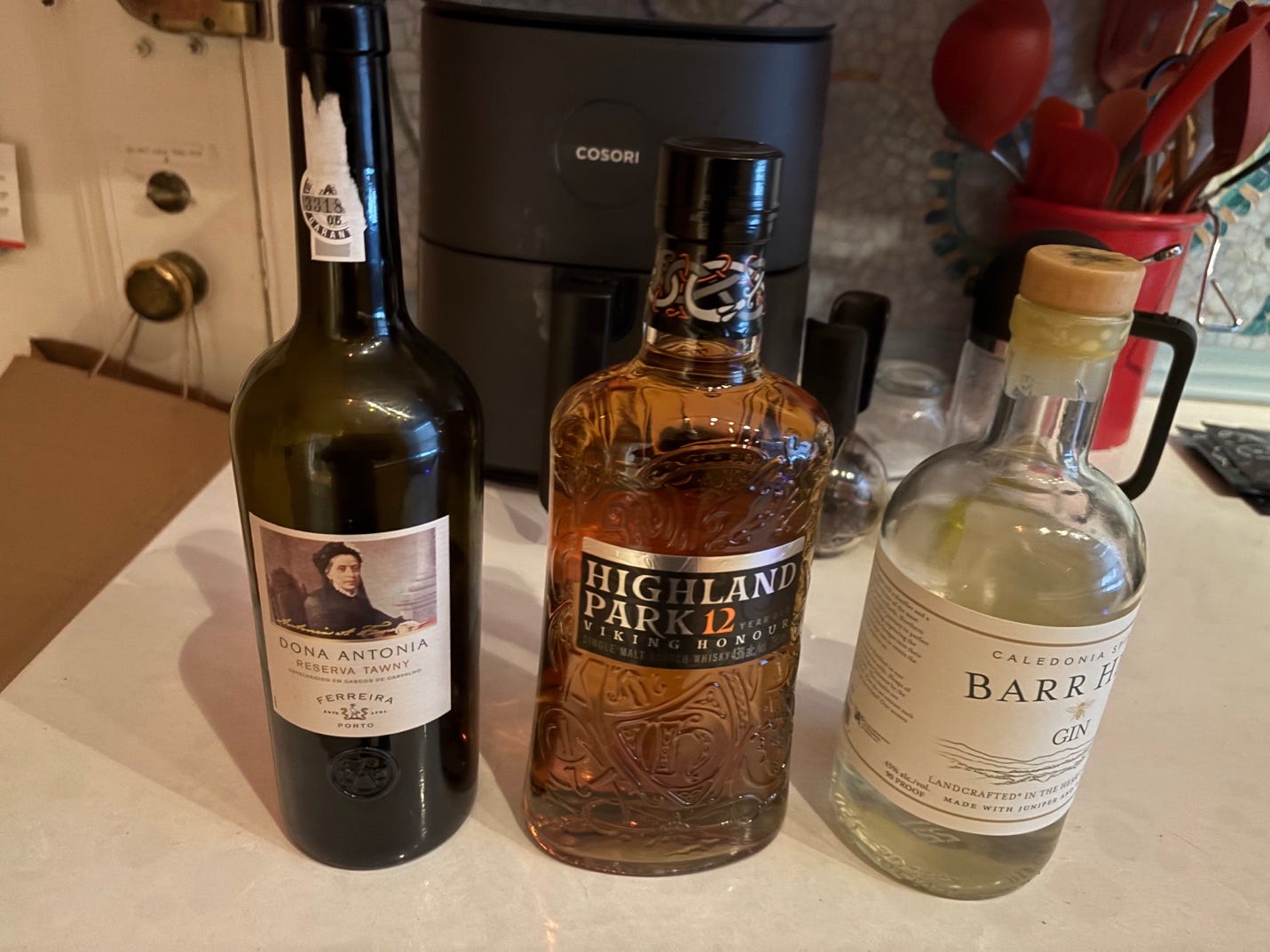 A group of bottles of alcohol

AI-generated content may be incorrect.