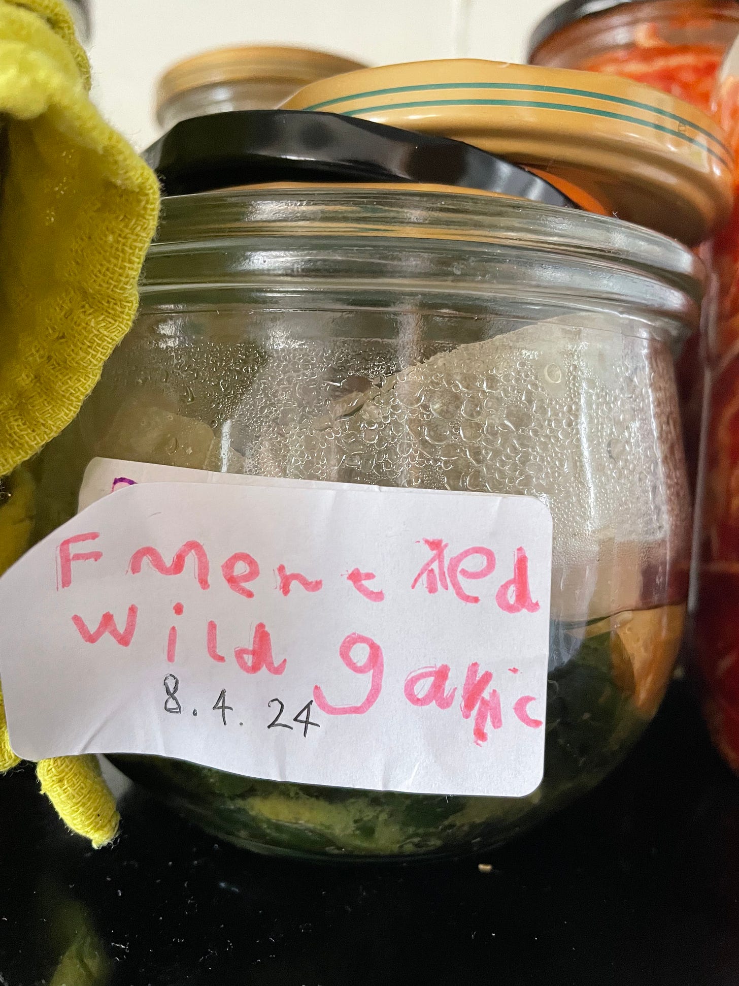 A jar of fermented wild garlic.