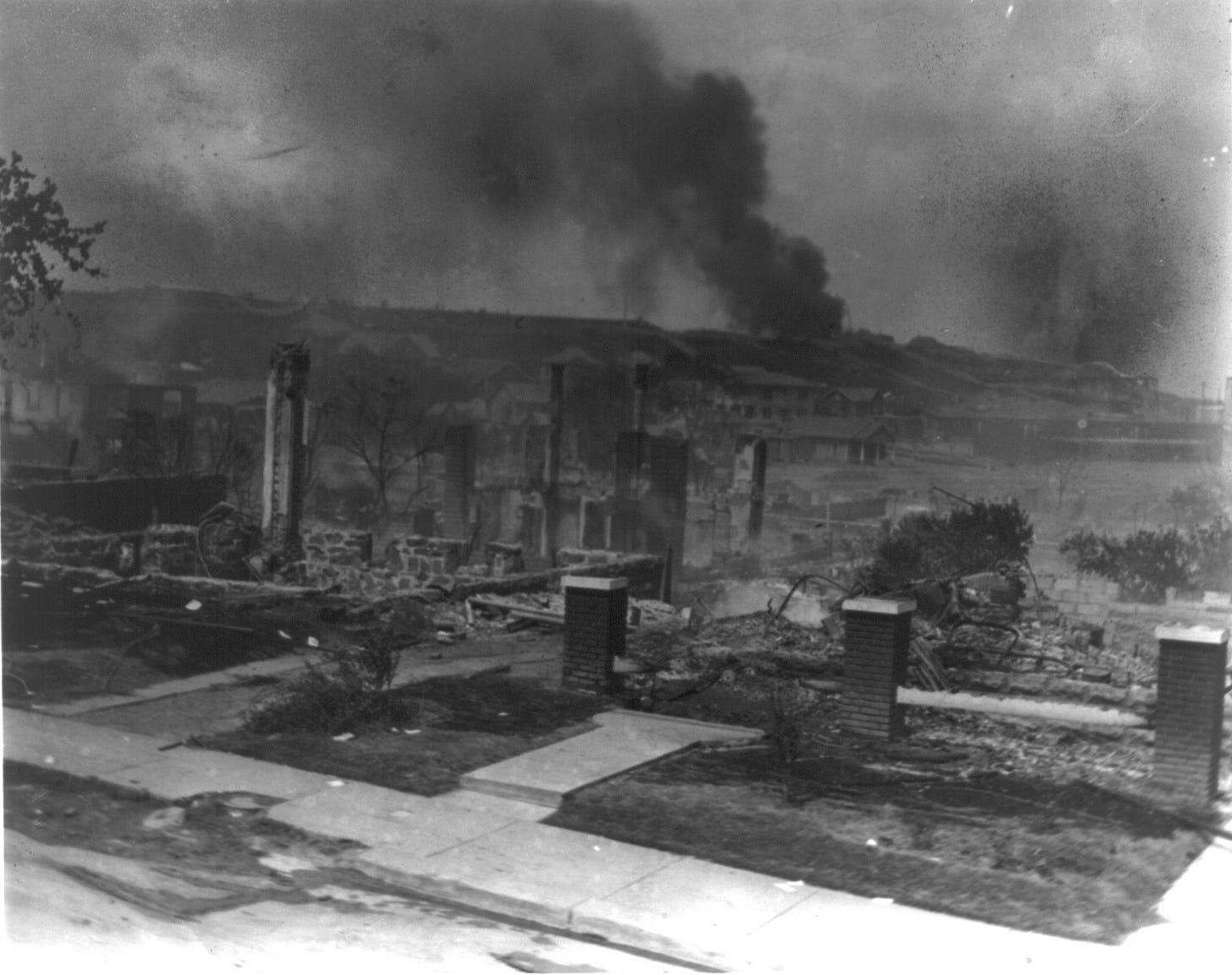 smoking ruins of building after the Tulsa race massacre