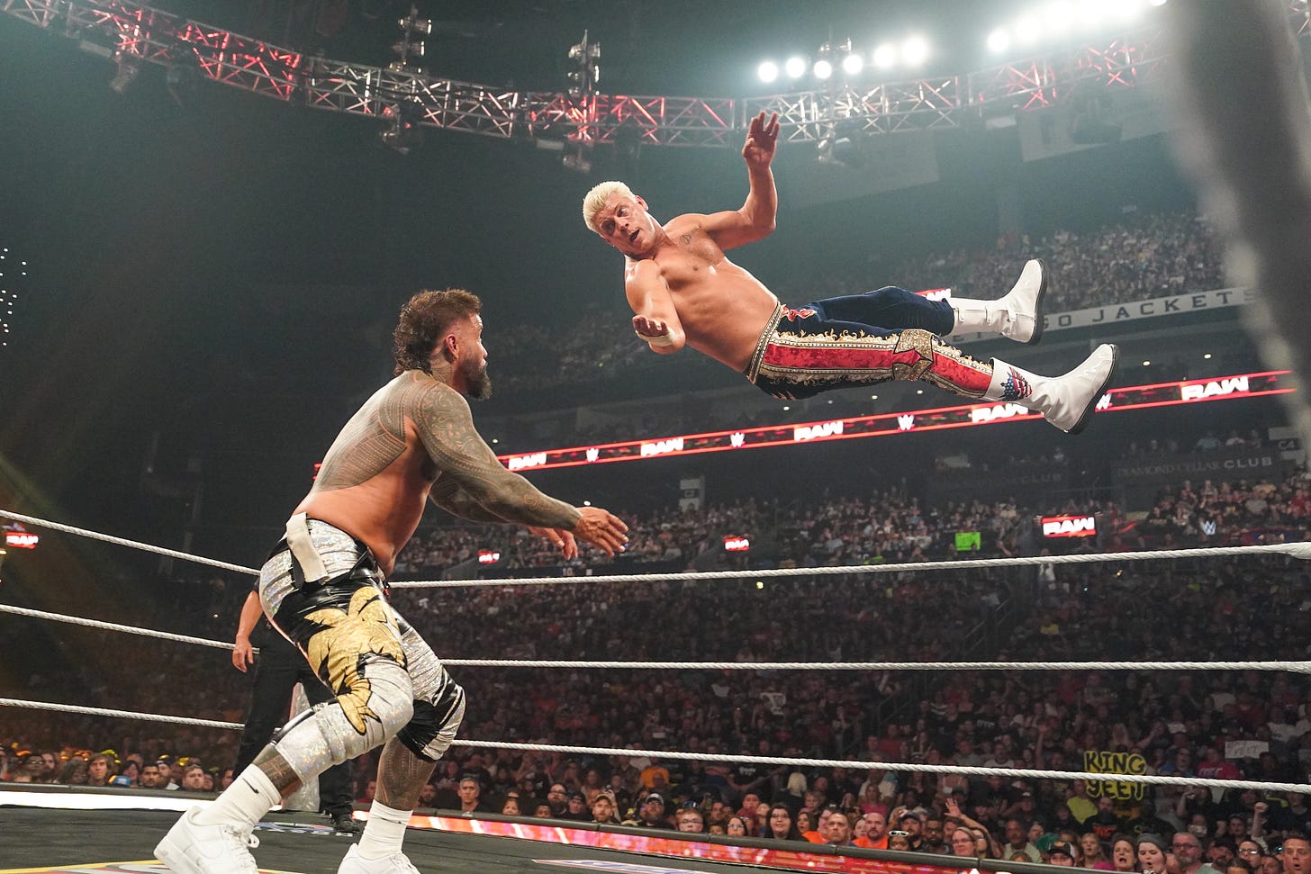 Cody Rhodes flies through the air during his match with Jey Uso 