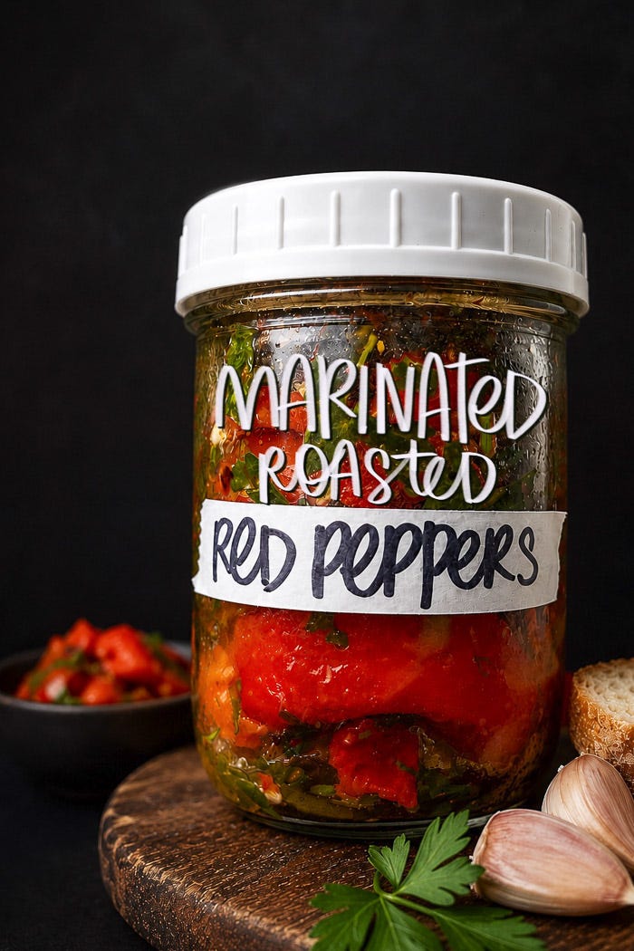 Sweet roasted red peppers marinated with garlic, herbs, and olive oil. An easy make-ahead recipe for sandwiches, salads, and snack boards. Full recipe on Shutterbean. Sweet roasted red peppers marinated with garlic, herbs, and olive oil. An easy make-ahead recipe for sandwiches, salads, and snack boards. Full recipe on Shutterbean.
