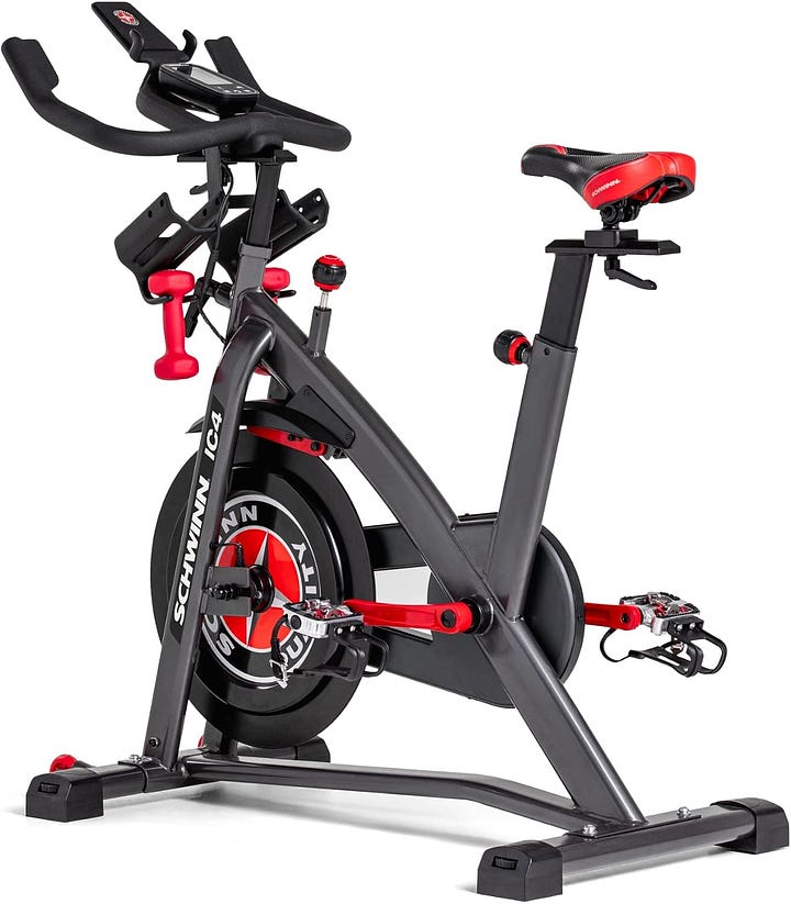 Red and black stationary Schwinn exercise bike