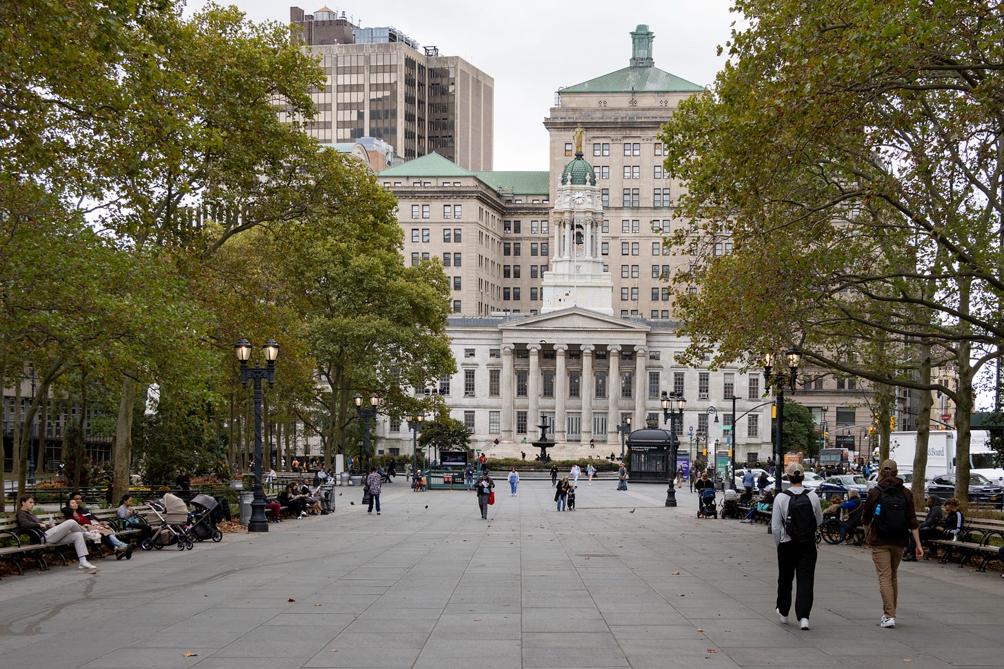 people walking around borough hall