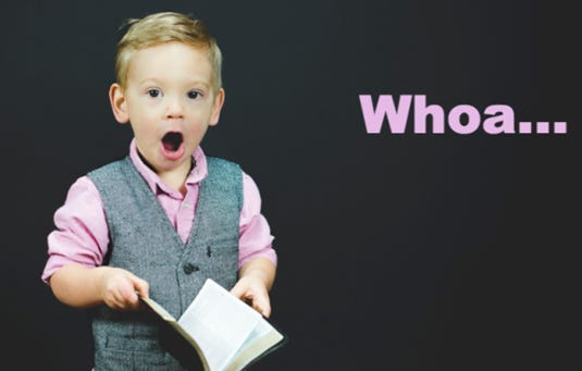 A young child holding a book

AI-generated content may be incorrect.