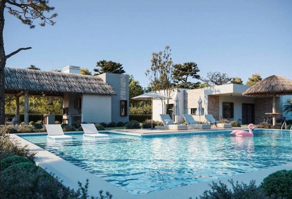 A pool with lounge chairs and a building

Description automatically generated