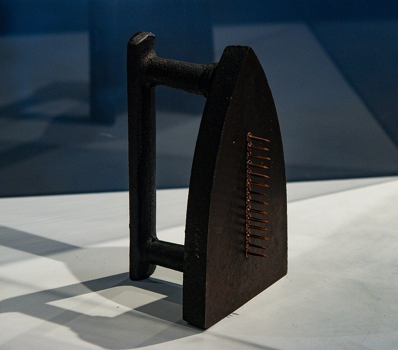 Man Ray, Cadeau, 1921, a flatiron with a row of brass tacks glued to its face Man Ray, Cadeau, 1921, a flatiron with a row of brass tacks glued to its face