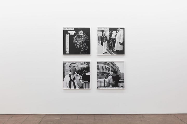 1) Four black-and-white photographs are displayed on a white gallery wall. Each image features people with speech bubbles, conveying a narrative tone in a comic style. These are the images from Tessa's sailor series. Each work is a square, in a thin white frame. The floor is a dark brown tiled flooring. 2) A minimalist art gallery with a white wall displaying seven black and white photos in a row. To the left, the wall features text about The Knight Move series that is displayed to the right of it. Bright overhead lighting. The flooring is a dark brown tile flooring. The beginning, middle, and end photos are large squares, while the 4 images, 2 on either side of the middle work are thin rectangular images.