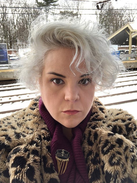 Aaron Jackson and Josh Sharp, both in faux fur coats, Josh's is leopard. Busy on the set of Busy Tonight in cat ears and a leopard dress. Caissie waiting for the train in a Leopard faux fur.