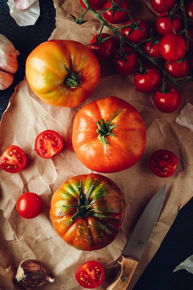 Tomatoes and a knife on a paper

AI-generated content may be incorrect.