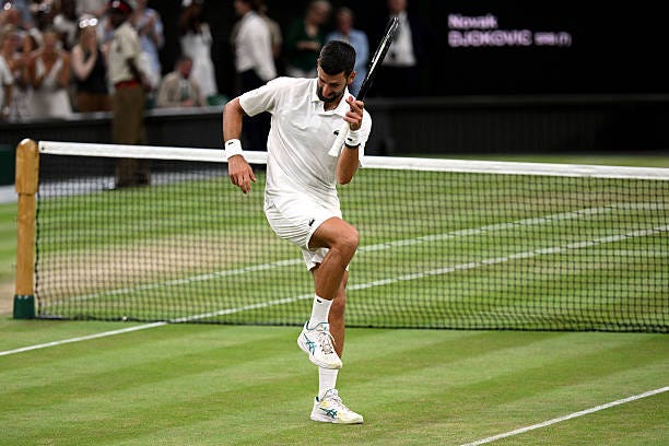 Novak Djokovic of Serbia celebrates victory against Felix Auger-Aliassime of Canada during their Gentlemen's Singles quarterfinal match on day nine...