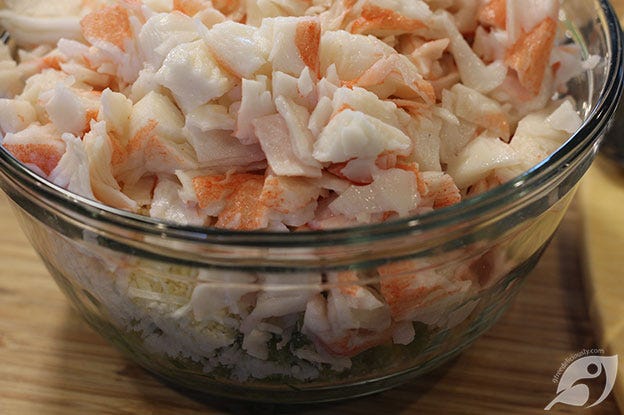 Showing the chopped crab added to the bowl. Showing the chopped crab added to the bowl.