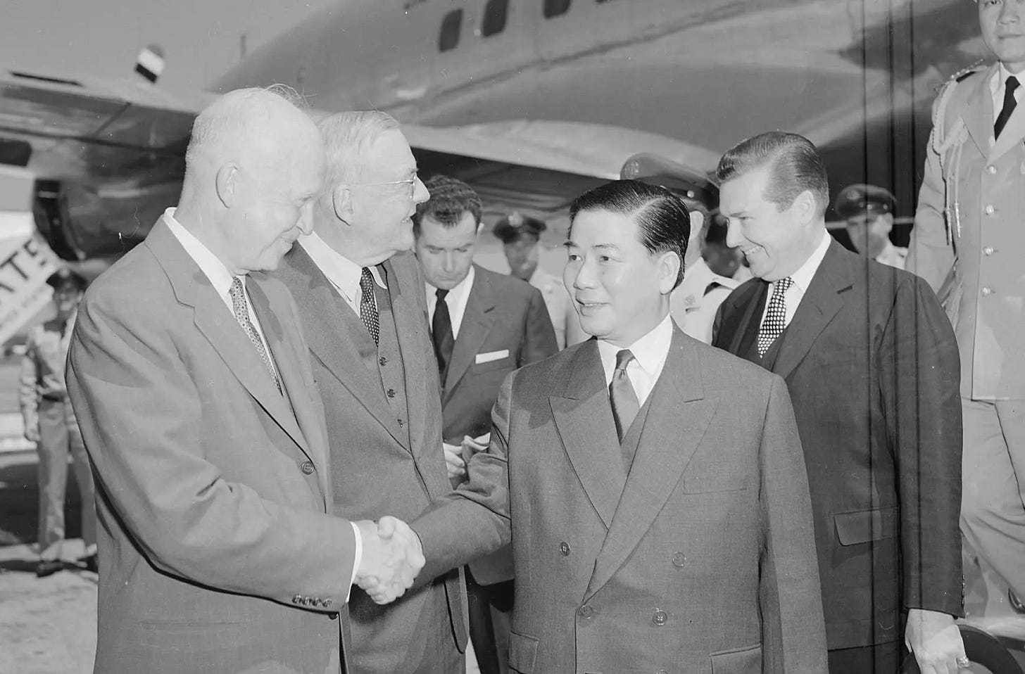 President Dwight D. Eisenhower and Secretary of State John Foster Dulles  (from left) greet South Vietnam's President Ngo Dinh Diem at Washington  National Airport. - DocsTeach