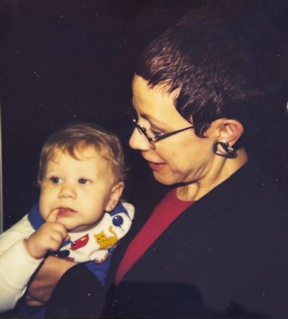 Middle-aged woman holding baby