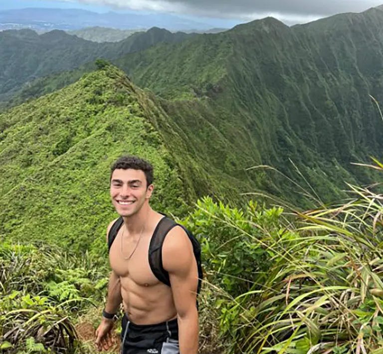 Facebook post of Luigi Mangione looking hot while shirtless on a hike.