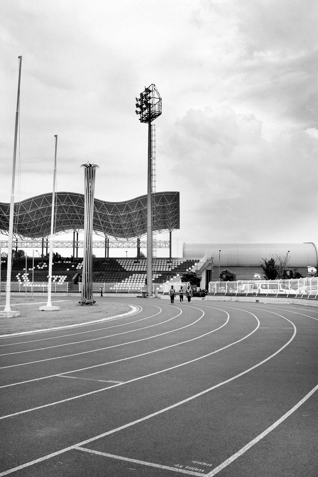 a track with a few people walking on it