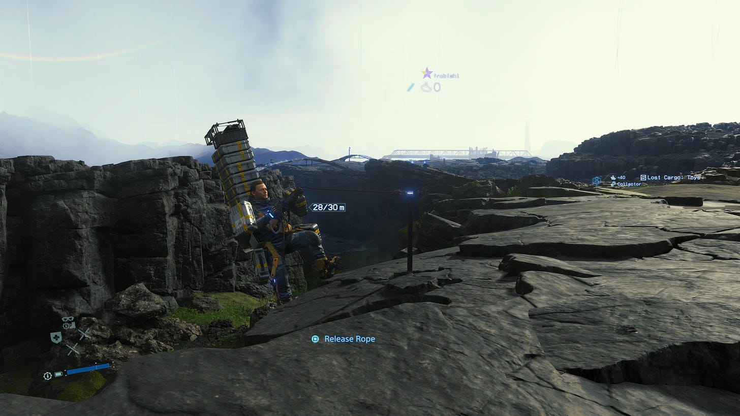 Screenshot of the player character rappelling into a ravine while carrying a large load of packages. Screenshot of the player character rappelling into a ravine while carrying a large load of packages.