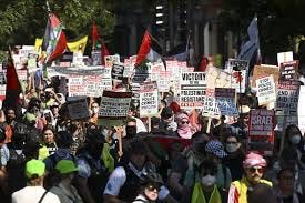 Some protesters tear down security ... Some protesters tear down security ...