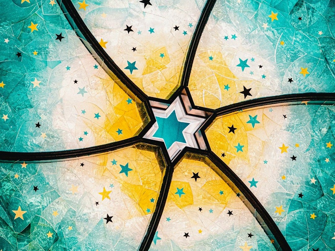 a painting of stars on a blue background