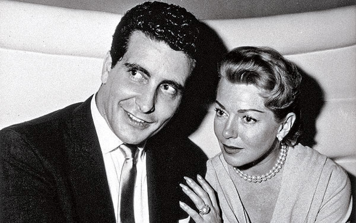 b/w photo of Stompanato and Turner: he an Italian-American gentleman of some stature, she a delicate movie star