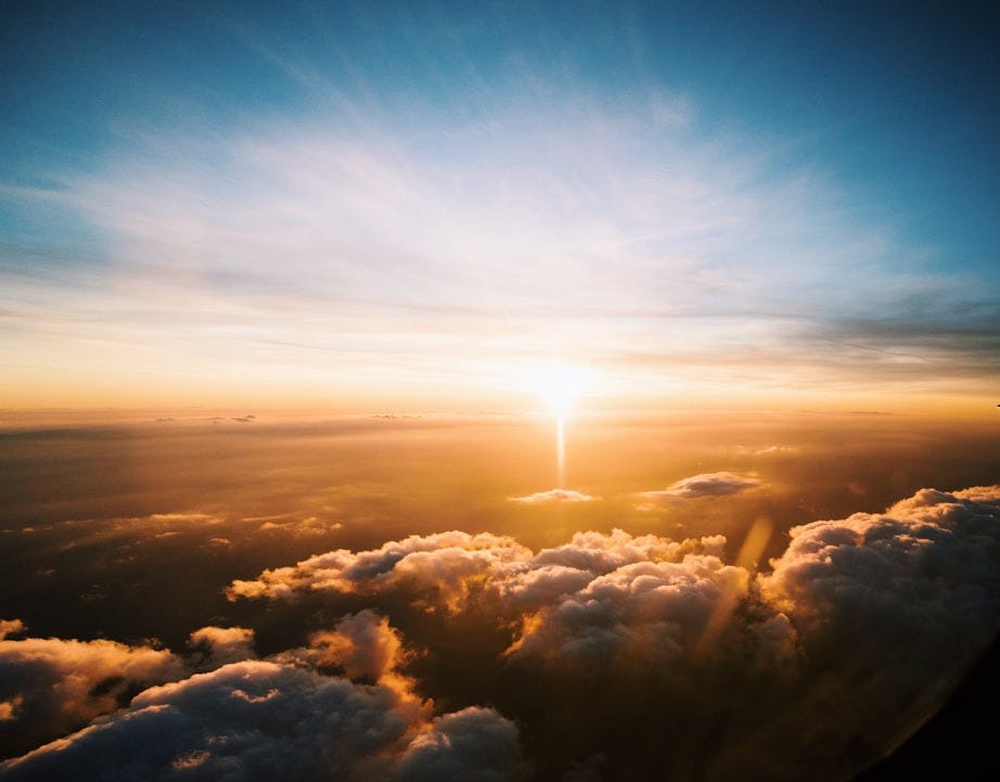 aerial view of sea of clouds during sunset