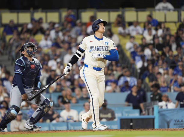 Los Angeles Dodgers designated hitter Shohei Ohtani hits a two-run home run, his 41st of the season, in the fifth inning of a baseball game against...