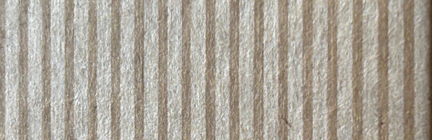 Stripes of brown and beige on Kraft card