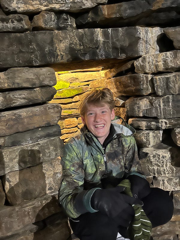 2025-6-26 Hudson in the mock-up Skara Brae home, photo by author