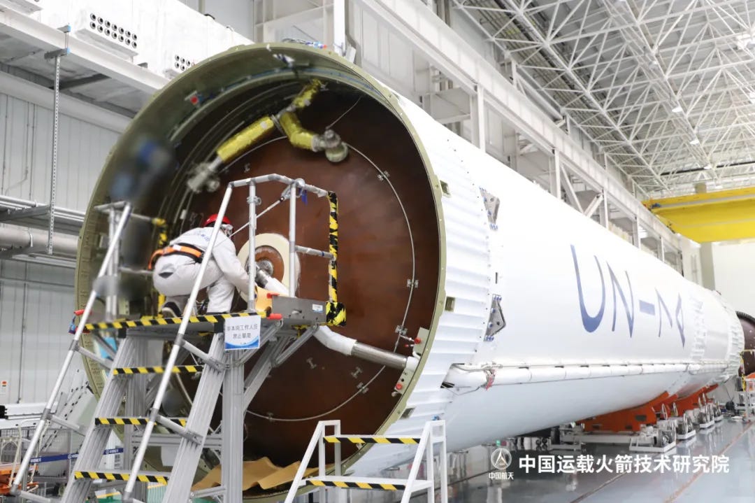 The Long March 7A’s first-stage undergoing preparations for flight in the weeks leading up to launch vehicle integration. The Long March 7A’s first-stage undergoing preparations for flight in the weeks leading up to launch vehicle integration.
