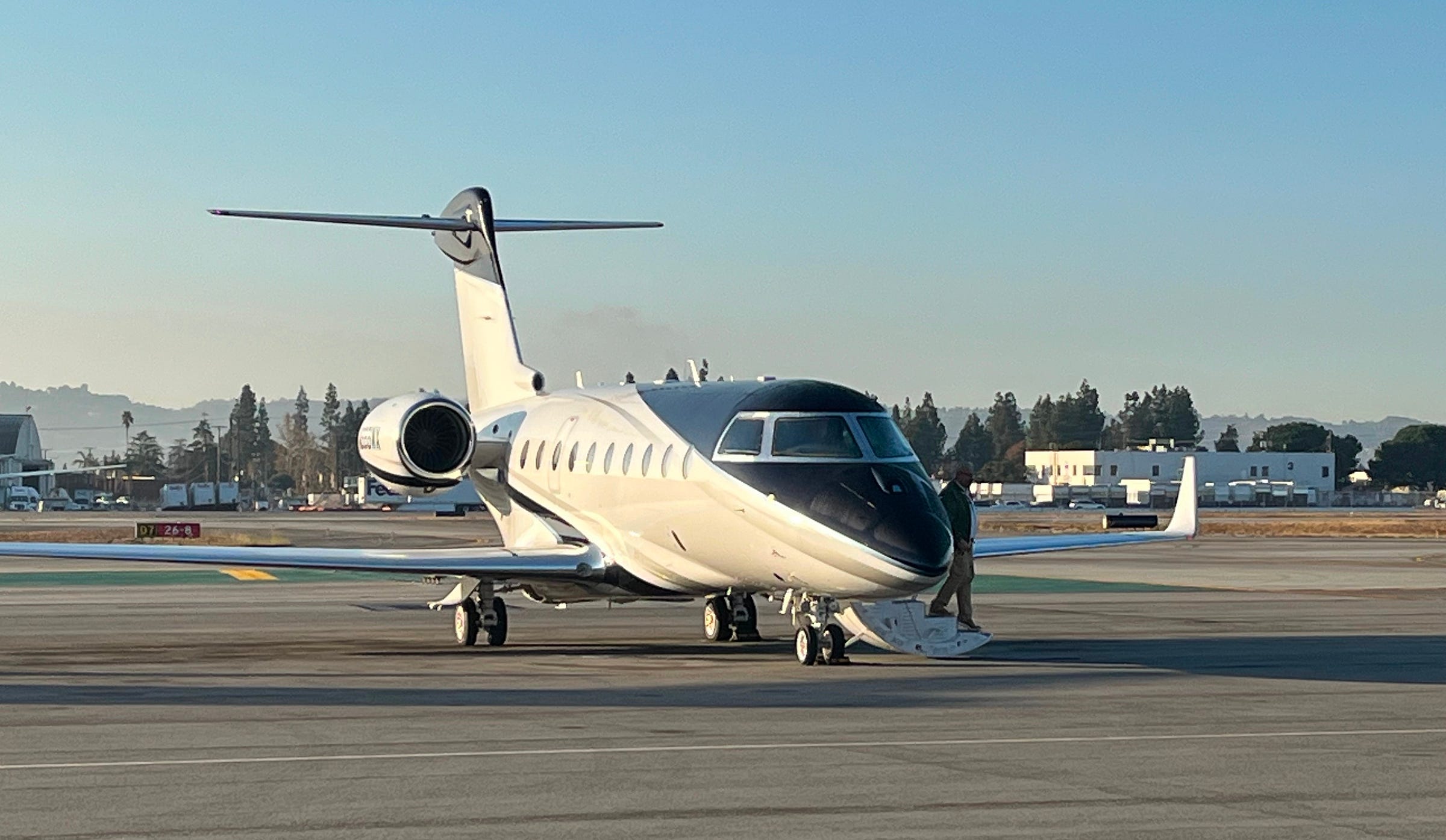 Photo of a private plane on a runway Photo of a private plane on a runway