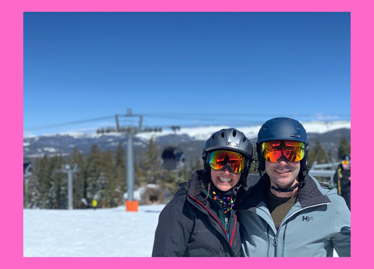 Couple smiling on the ski slopes