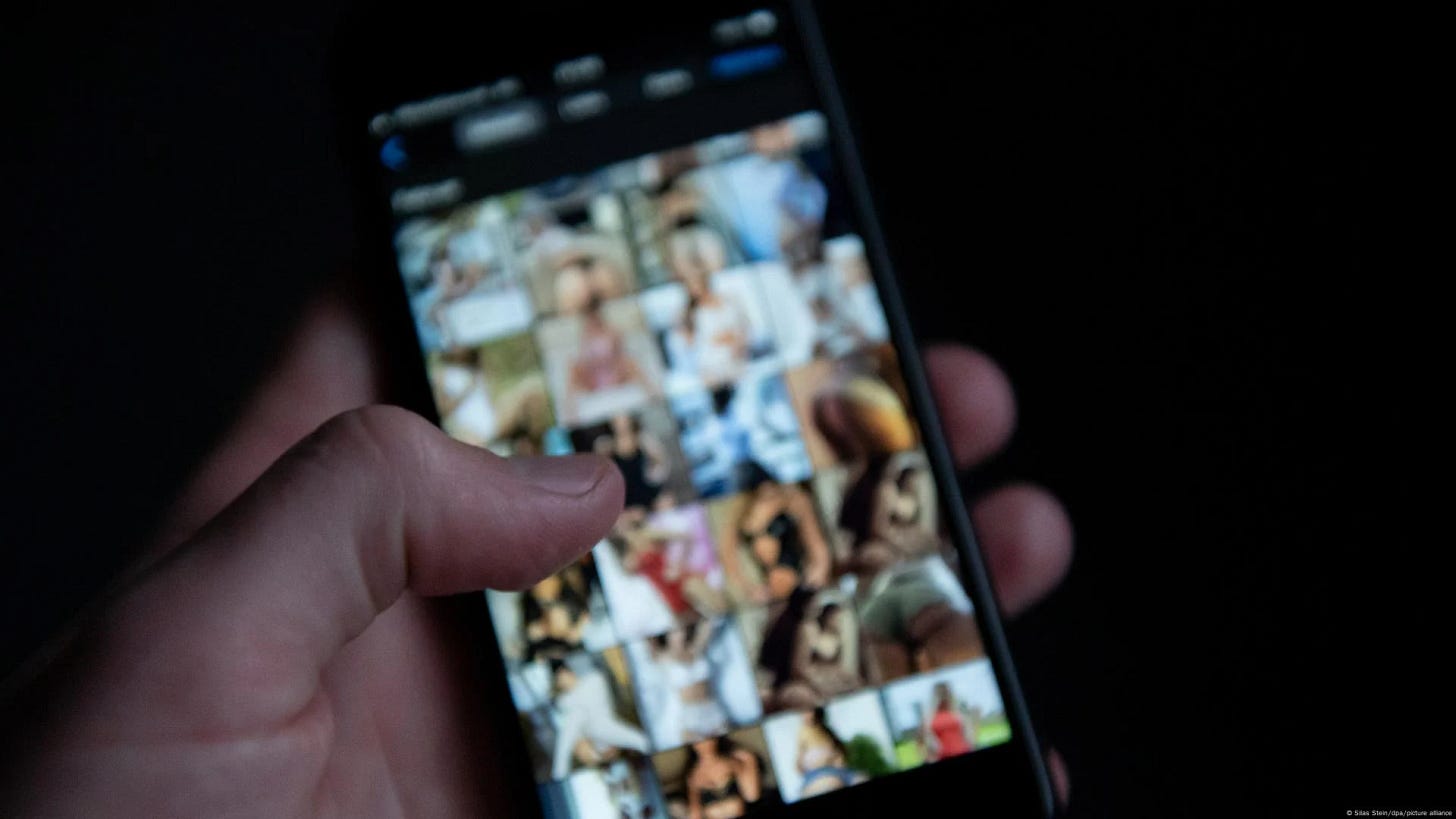 Hand holding a smartphone displaying a blurred photo gallery of intimate images. Hand holding a smartphone displaying a blurred photo gallery of intimate images.