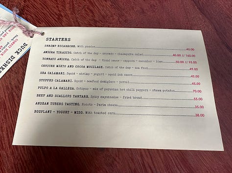 The pages of Awicha's menu including appetizers, duck dishes, mains, and an extensive beverage menu.