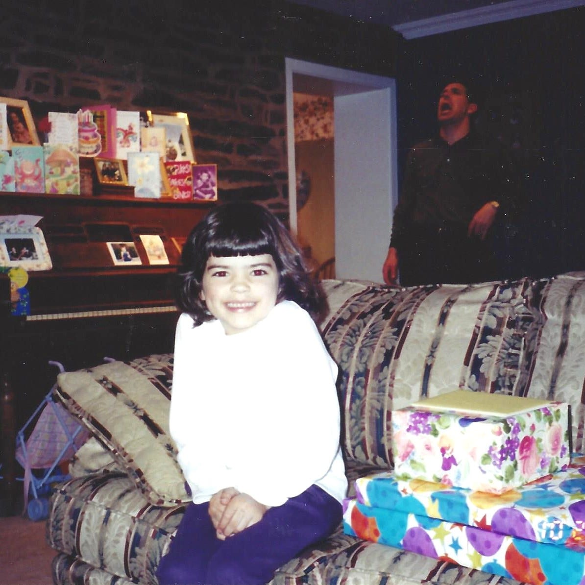 6-year-old girl gleefully anticipates opening her birthday presents 6-year-old girl gleefully anticipates opening her birthday presents