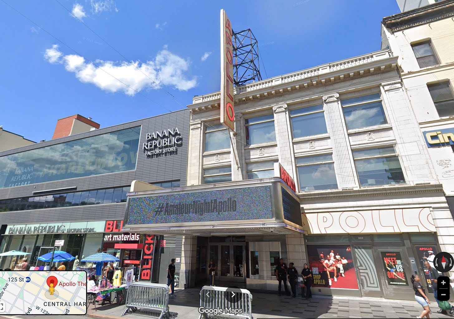 Screenshot of Google Street View, showing a Banana Republic Factory Store on the left, Apollo Theater on the right, with a large vertical "APOLLO" sign and a marquee showing "#AmateurNightApollo"