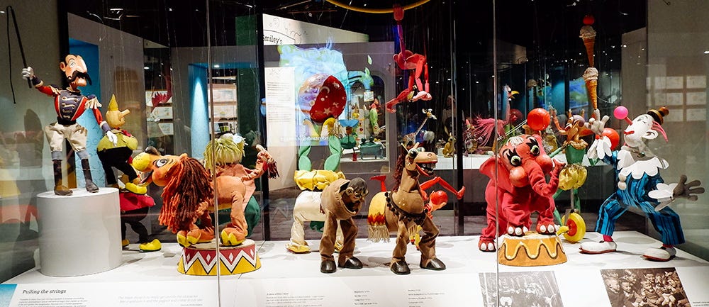 A bunch of beautiful old puppets.