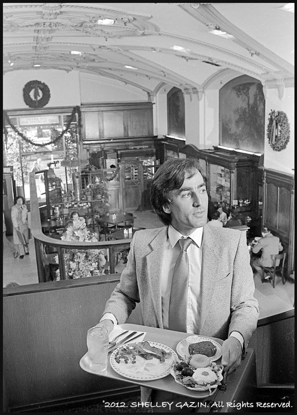 A diner carries a tray in Clifton's Silver Spoon. 1981 photo by Shelley Gazin, courtesy of the Gazin Archive.