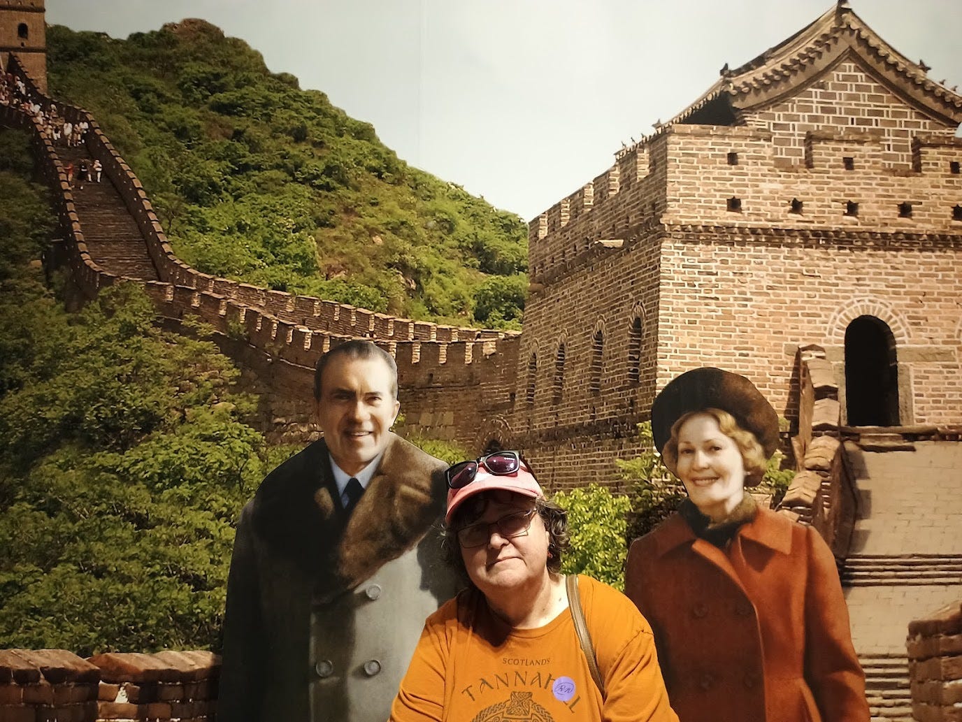 Annette with photo of Richard and Pat Nixon at the Great Wall of China