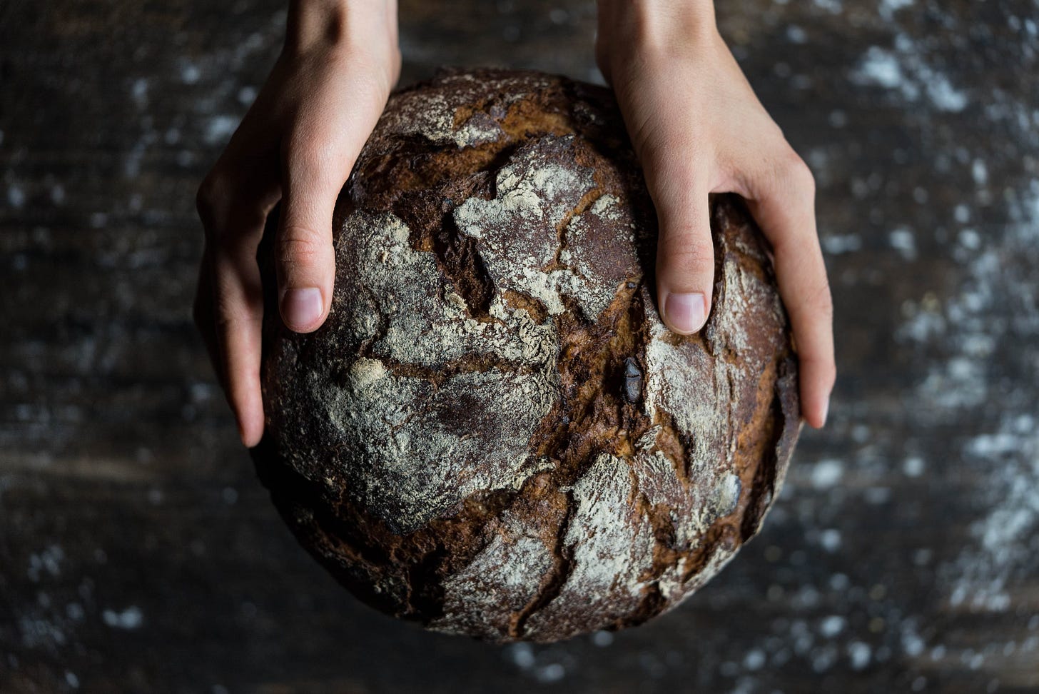Hands holding bread