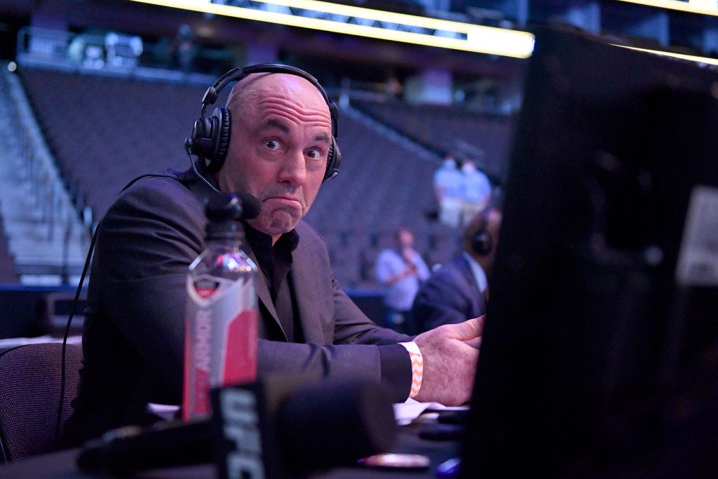 Podcast host Joe Rogan stares at the camera. Podcast host Joe Rogan stares at the camera.