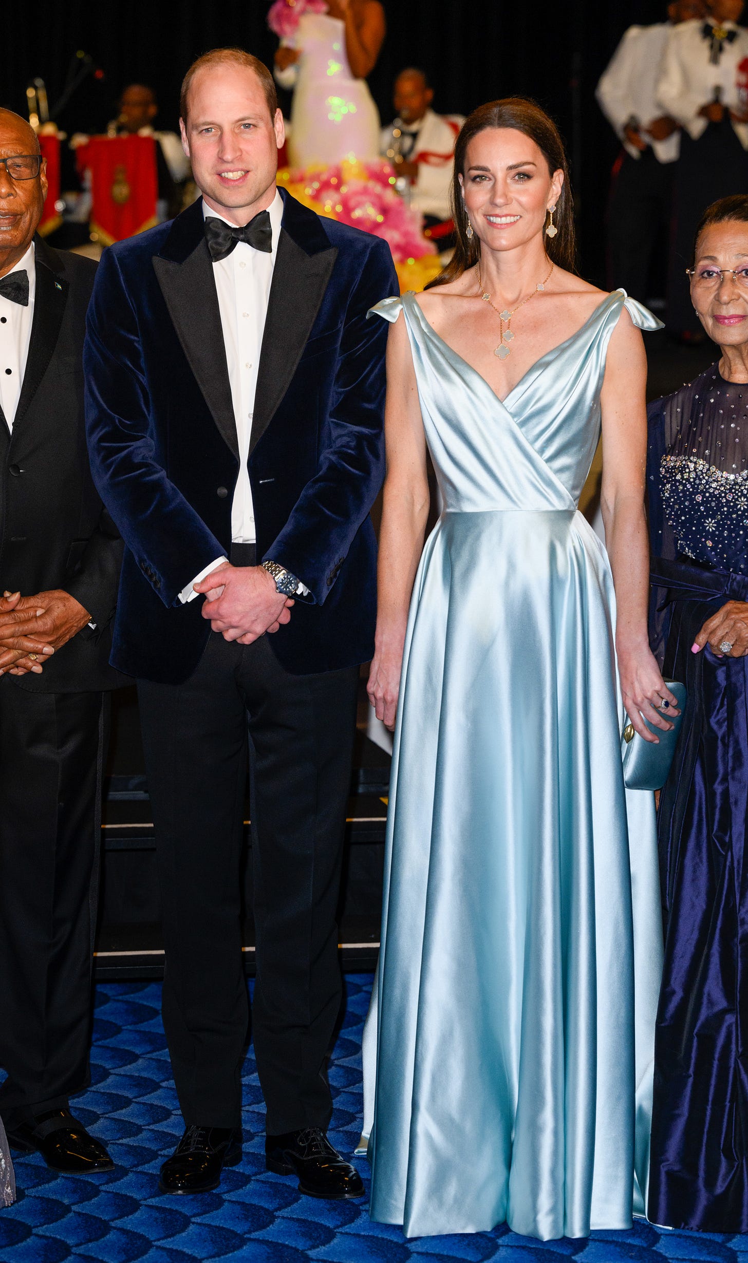 Prince William in a suit next to Princess Catherine in a light blue dress