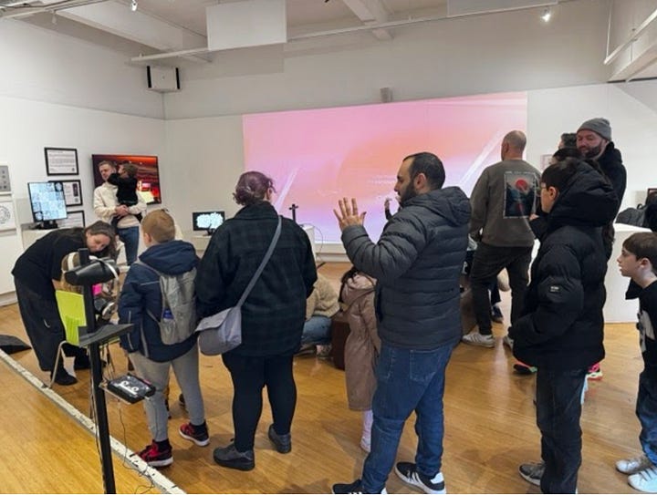 young people and families taking part in making robots out of cardboard boxes