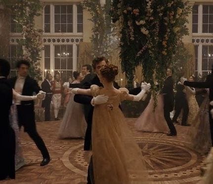 This may contain: a group of people in formal wear dancing This may contain: a group of people in formal wear dancing