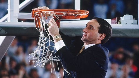 Coach K cutting the nets
