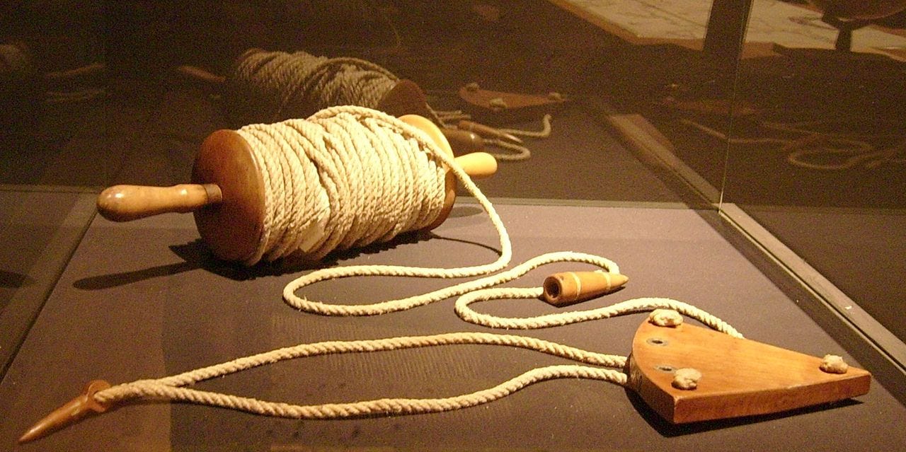 Chip log - wooden piece gets thrown out in water and sailors let rope unrole.