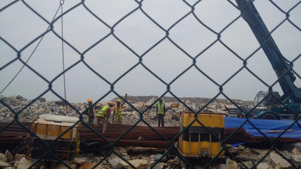 Workers inside the port city project area. Image: Wade Shepard. 