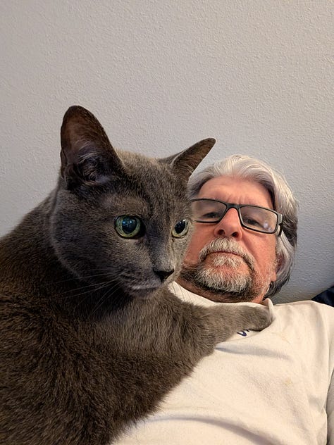 Greg Rowland with his cat Big Bit