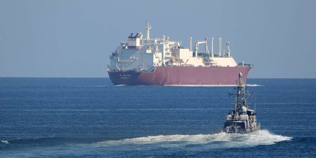 Tanker and destroyer in the Strait of Hormuz