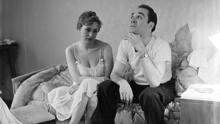 A black-and-white photo of a couple looking unhappy A black-and-white photo of a couple looking unhappy
